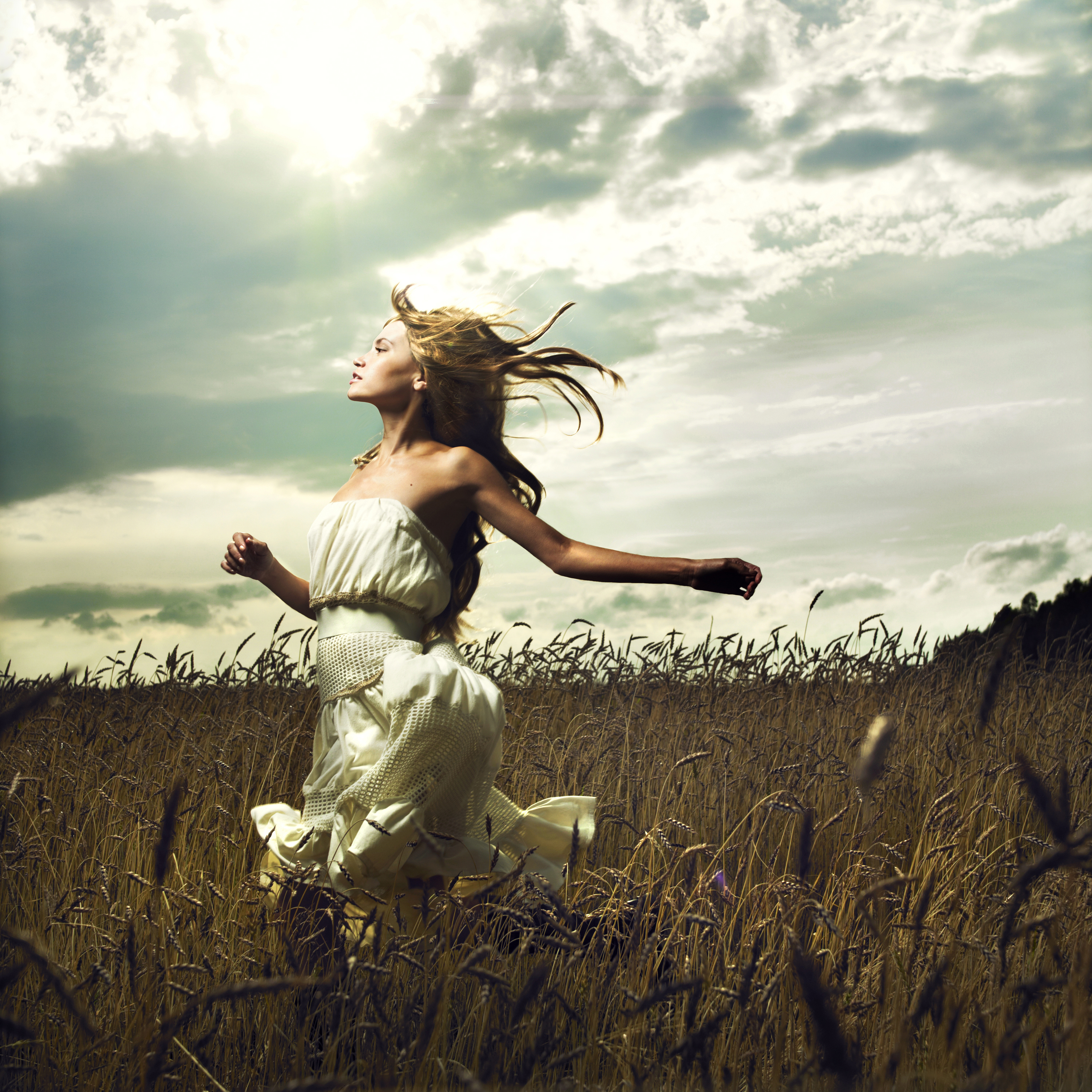 Girl running across field